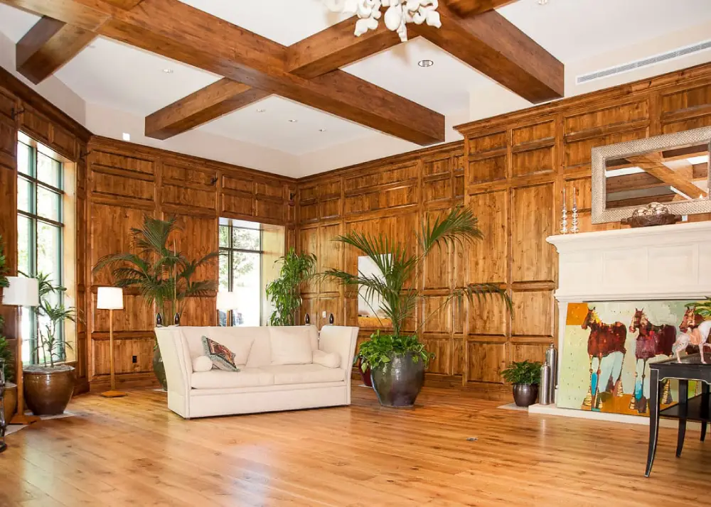 A photo of a room with a new wood design.