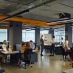 Modern office with yellow pipes featuring colors that increase productivity