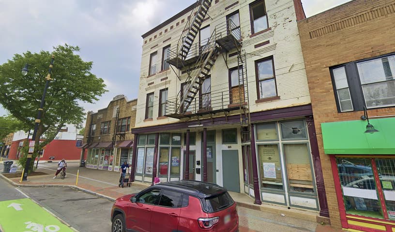 Multi-story commercial building with storefronts