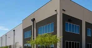 Exterior painting of modern commercial warehouse building