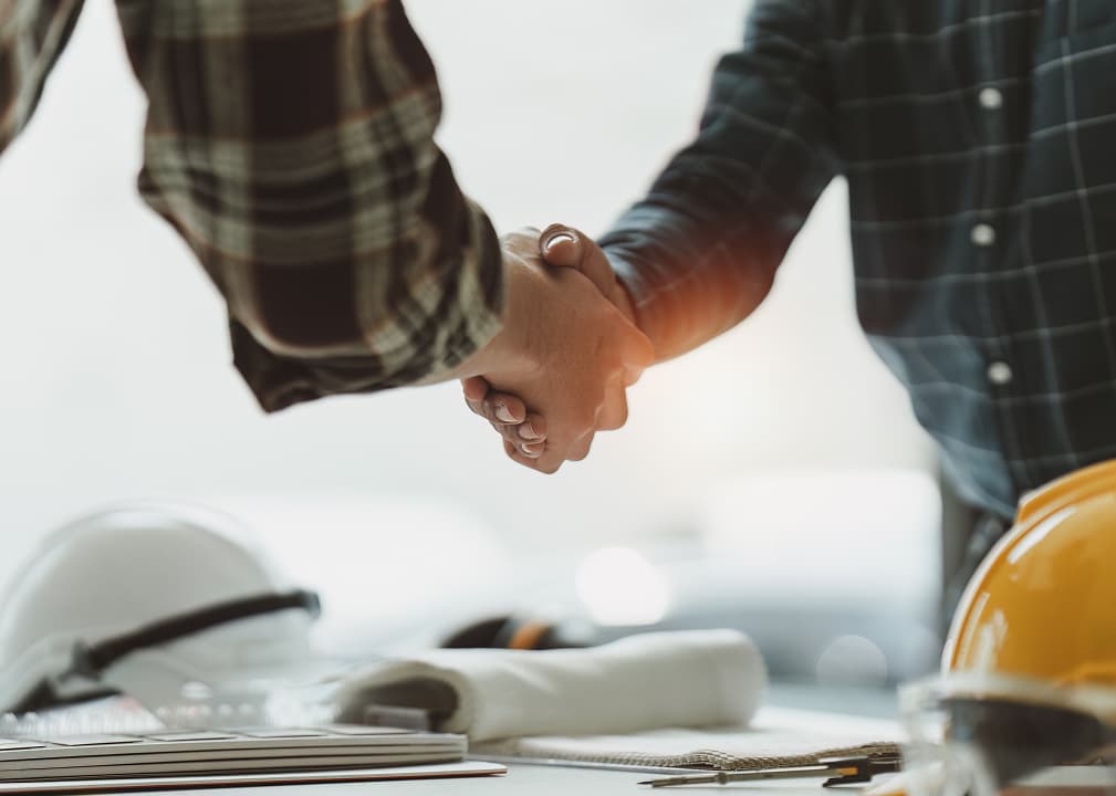 Handshake between contractors symbolizing partnership