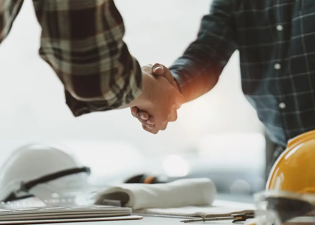 Handshake between contractors symbolizing partnership