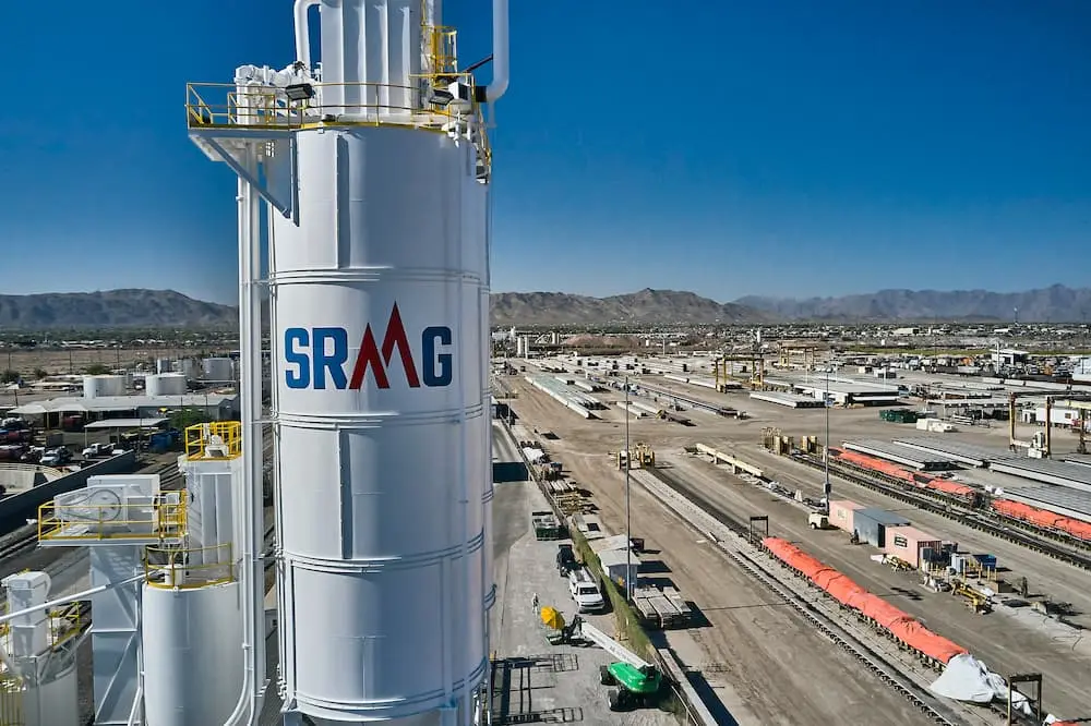 Industrial plant exterior showing painted equipment and structures