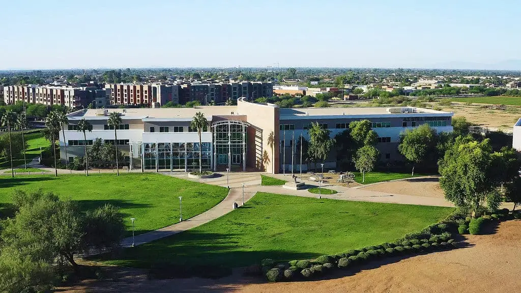 Aerial view of modern institutional building with landscaped campus grounds