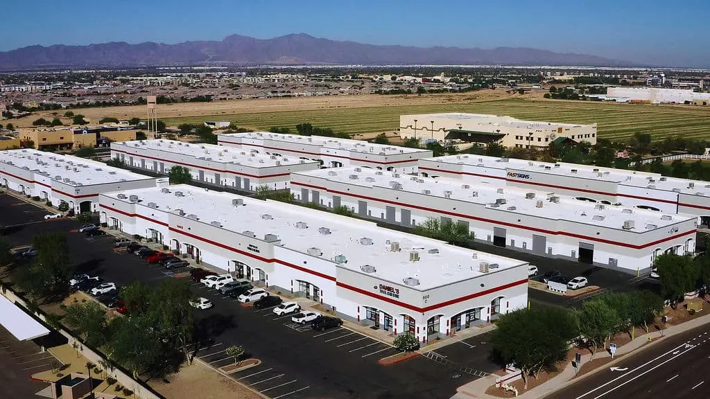Aerial view of retail and commercial storefront buildings with painted facades