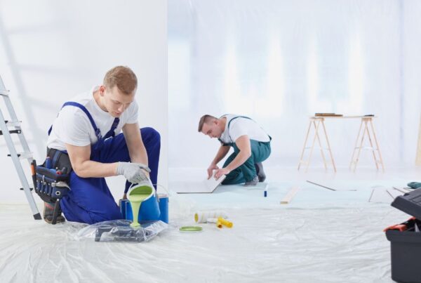 Two local commercial painting contractors working on a project