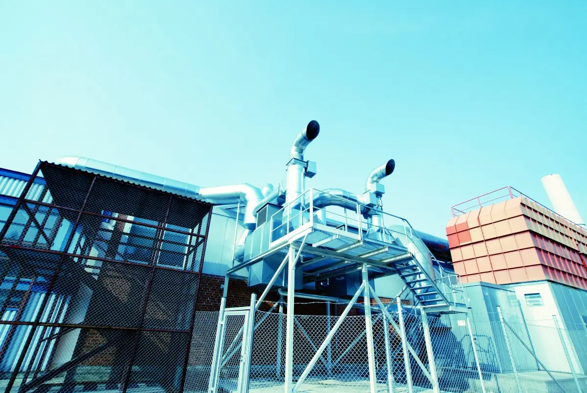 Commercial HVAC cooling towers and building HVAC structures showing rooftop mechanical systems