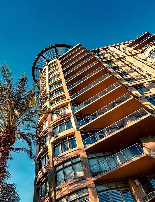 Contemporary multi-story building featuring curved balconies